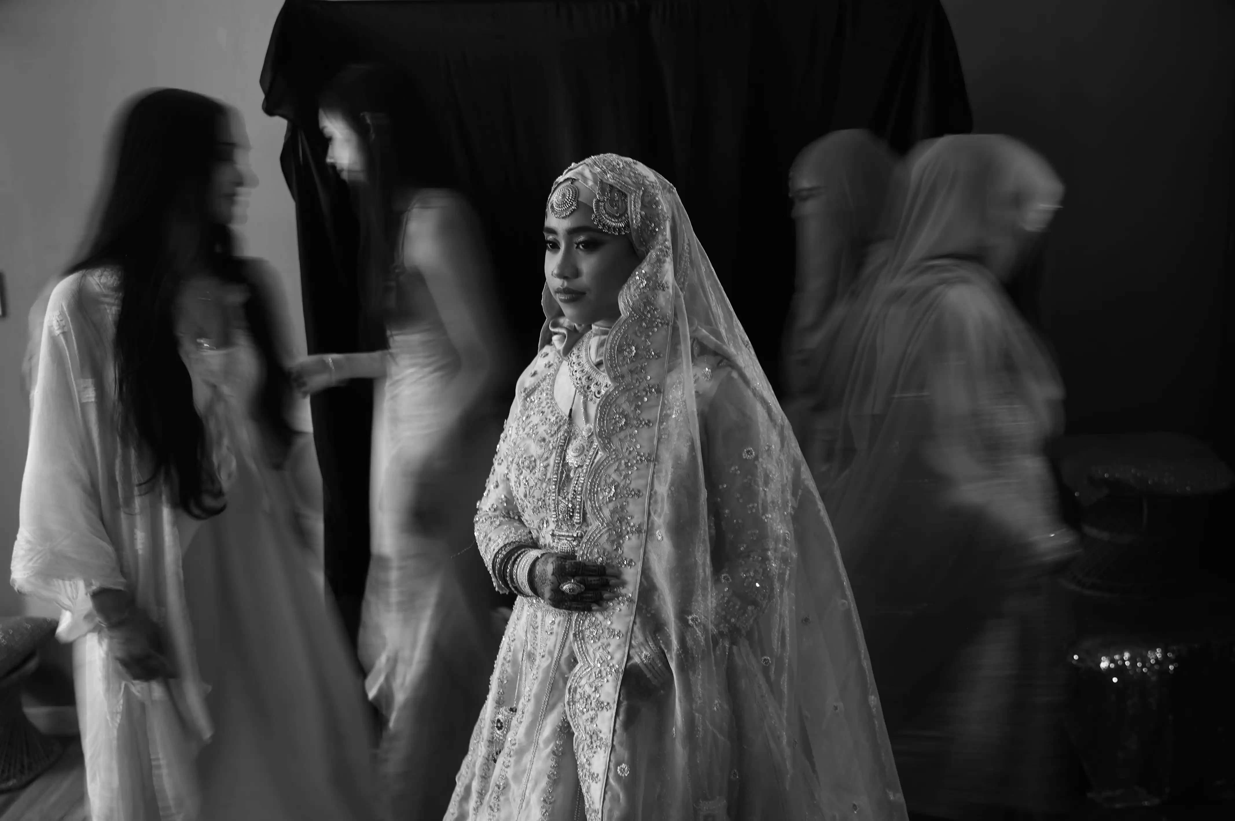 Bride in gold smiling warmly